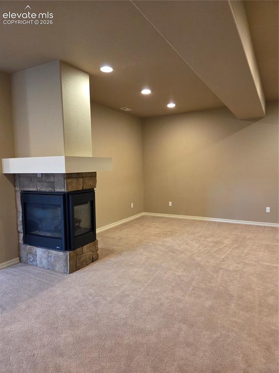 Image 30 of 33: 3 sided fireplace in familyroom-entertainment area.