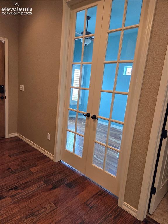 Image 5 of 33: Office-Bedroom french doors, full bathroom next door.
