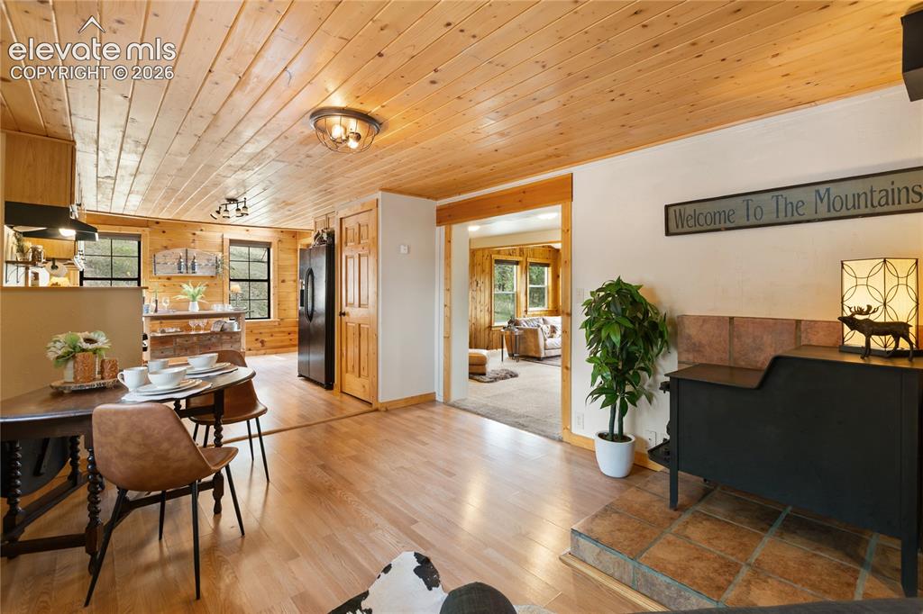 Image 11 of 37: There is a designated dining area and sitting area open to the kitchen with