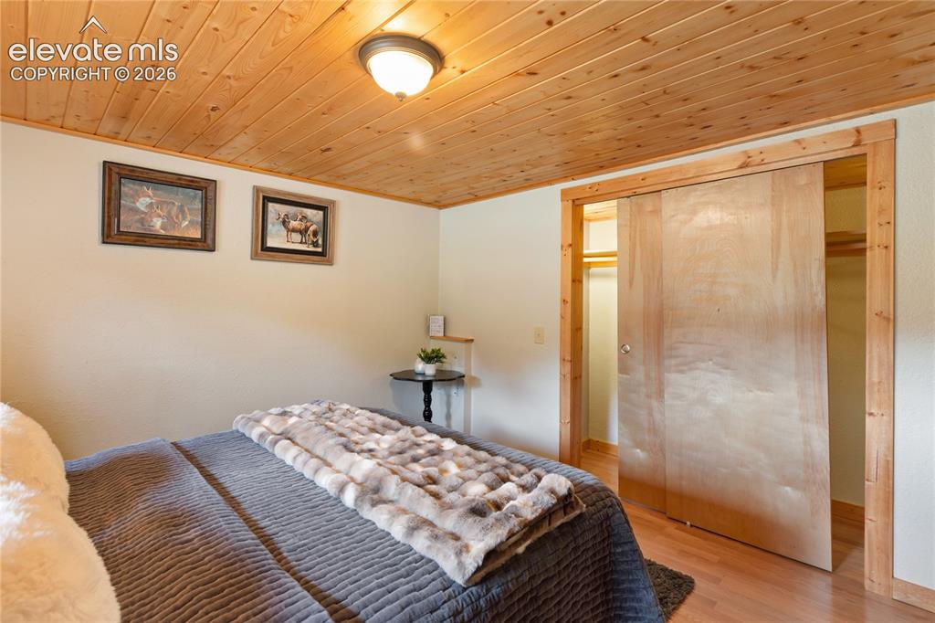 Image 20 of 37: Before we go upstairs, let me show you the main level bedroom.