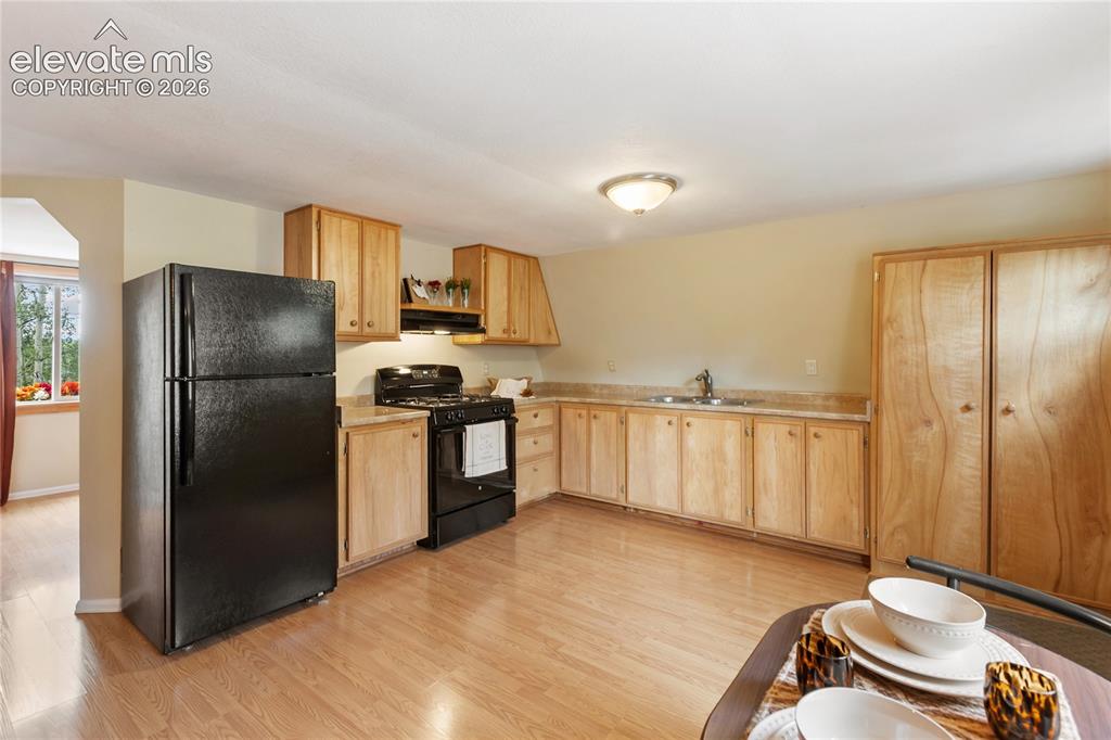 Image 28 of 37: Lots of room in this open concept living room, dining room, kitchen.
