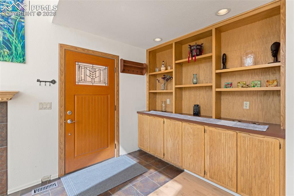 Image 3 of 30: View of the Entrance and Built-in Bookshelves