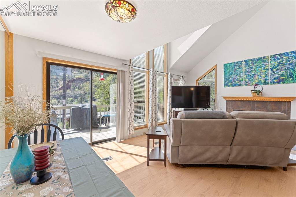 Image 6 of 30: Sliding Glass Door in the Living Room, Out to the Front Deck