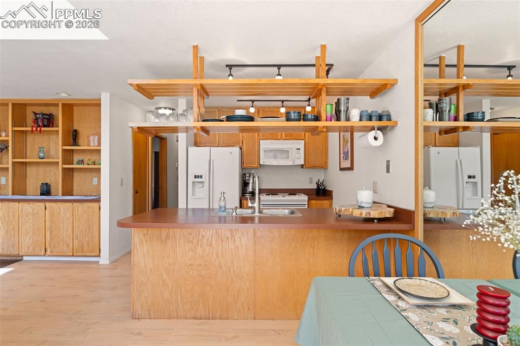 Image 8 of 30: Dining Room To Kitchen View