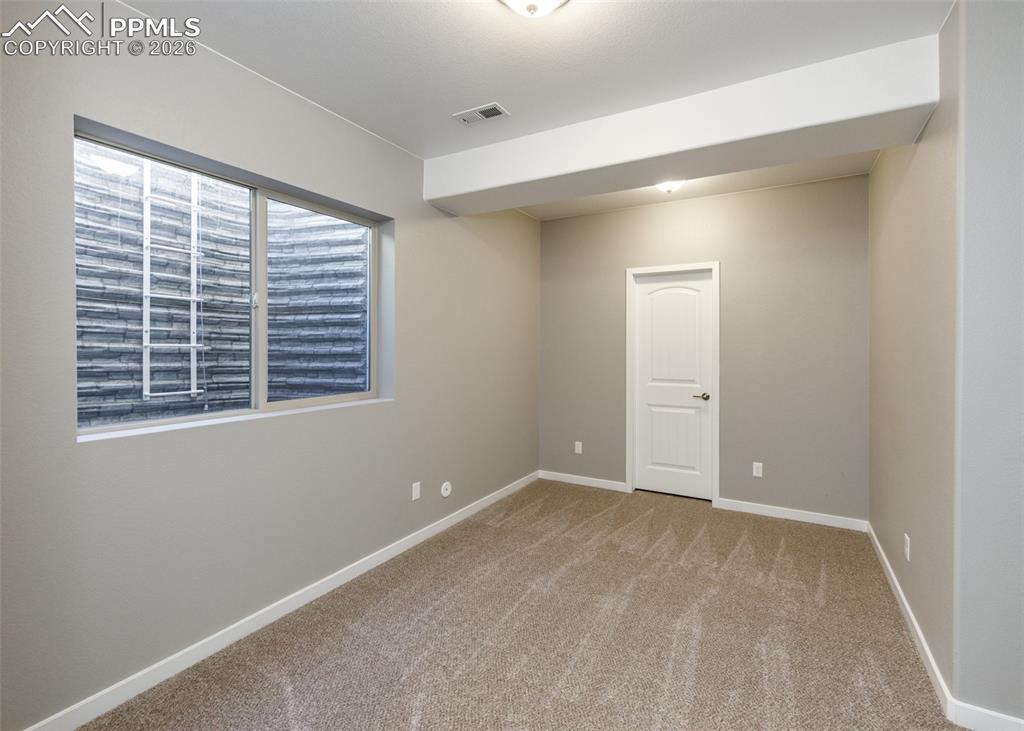 Image 42 of 50: Basement Bedroom
