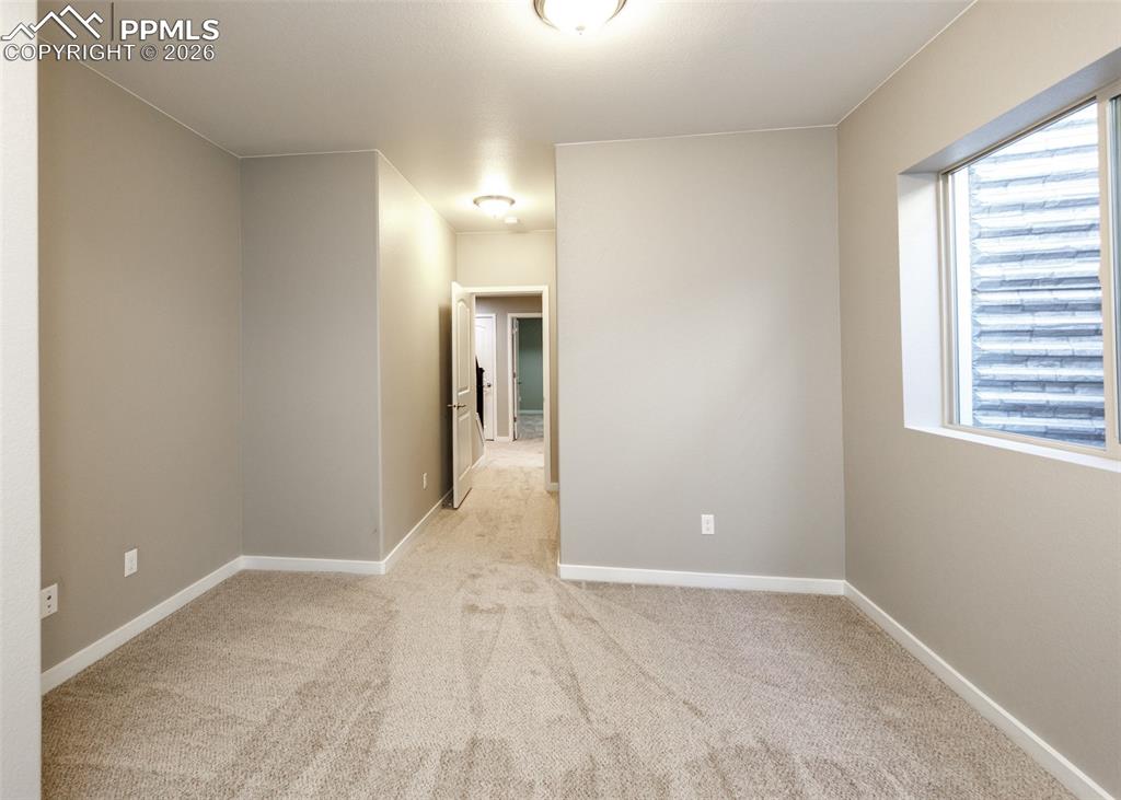 Image 43 of 50: Basement Bedroom