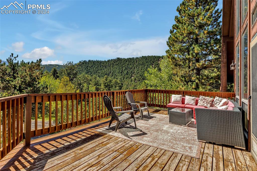 Image 24 of 40: Spacious Wrap Around Deck, Patio, Mountain Views,