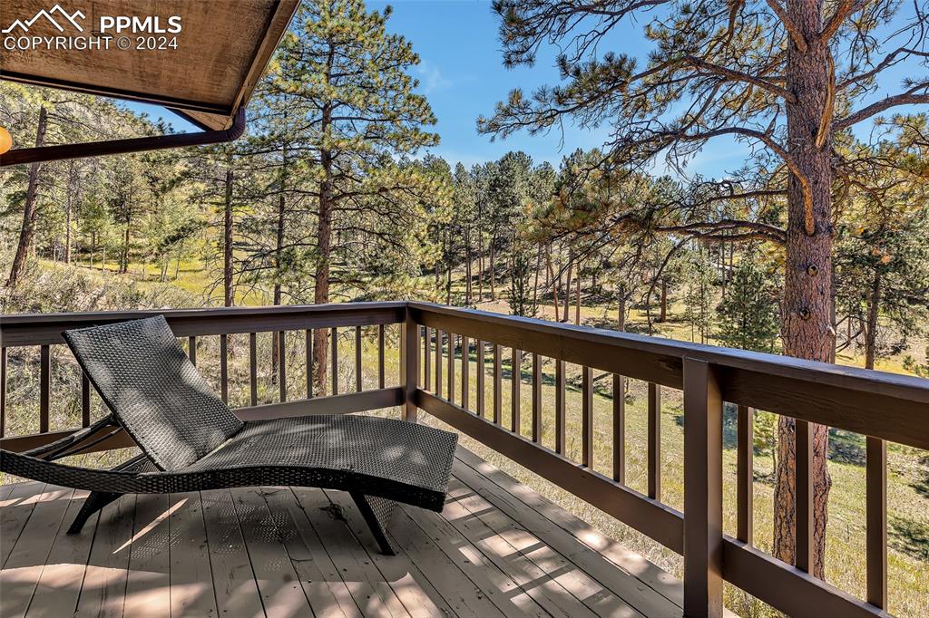 Image 25 of 40: Treed property, Large Deck, Relaxing Chair,