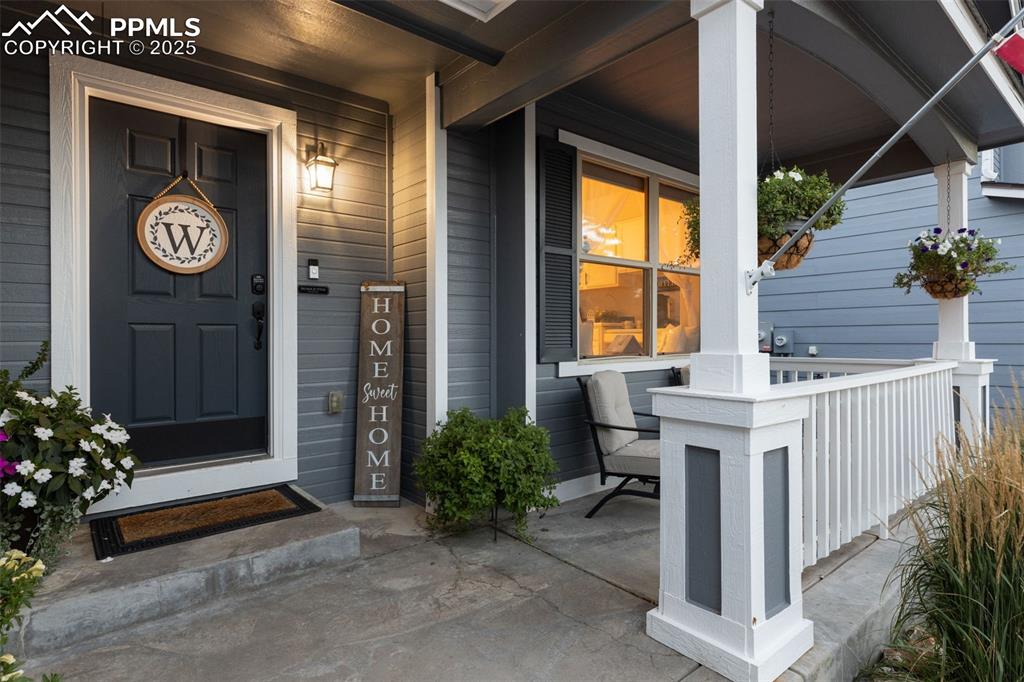 Image 10 of 39: View of exterior entry with a porch