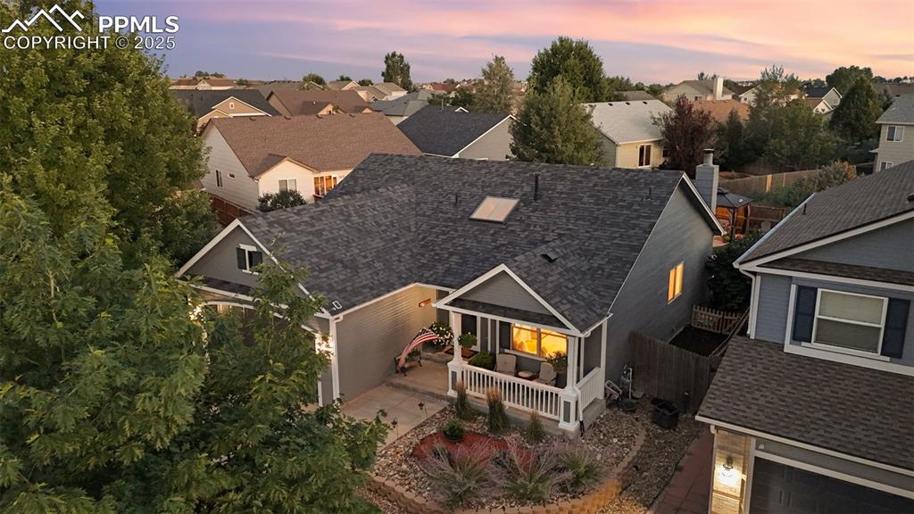 Image 3 of 39: Aerial view at dusk of a residential view