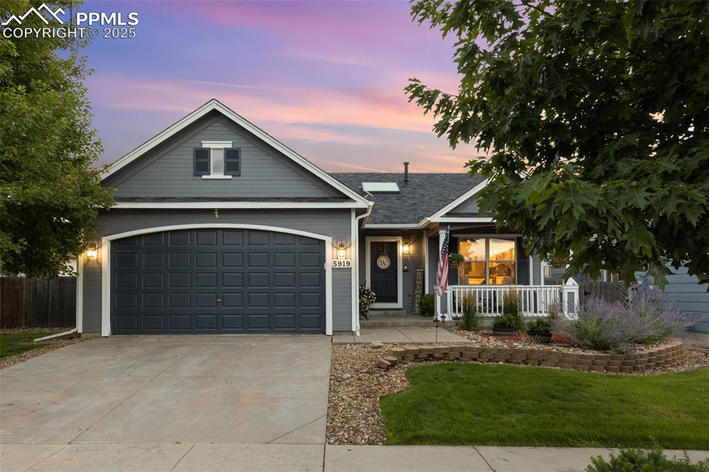 Image 9 of 39: View of front of house featuring concrete driveway and a shingled roof
