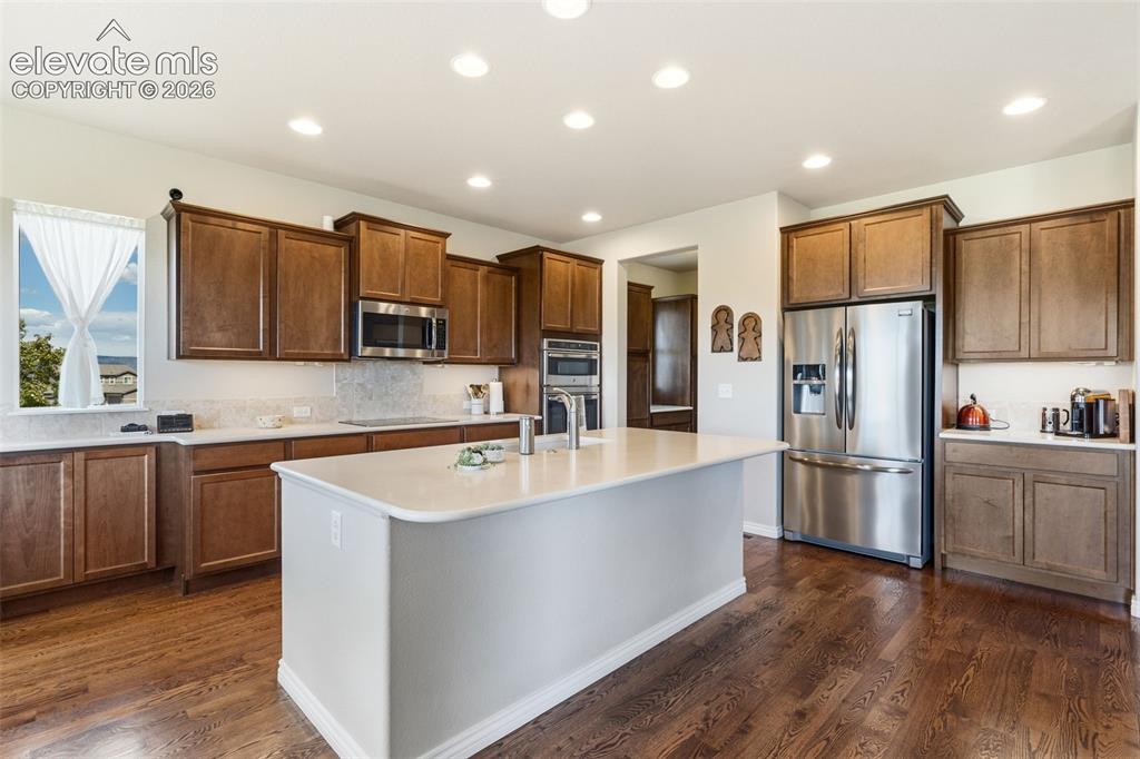 Image 13 of 49: Kitchen featuring stainless appliances, butler