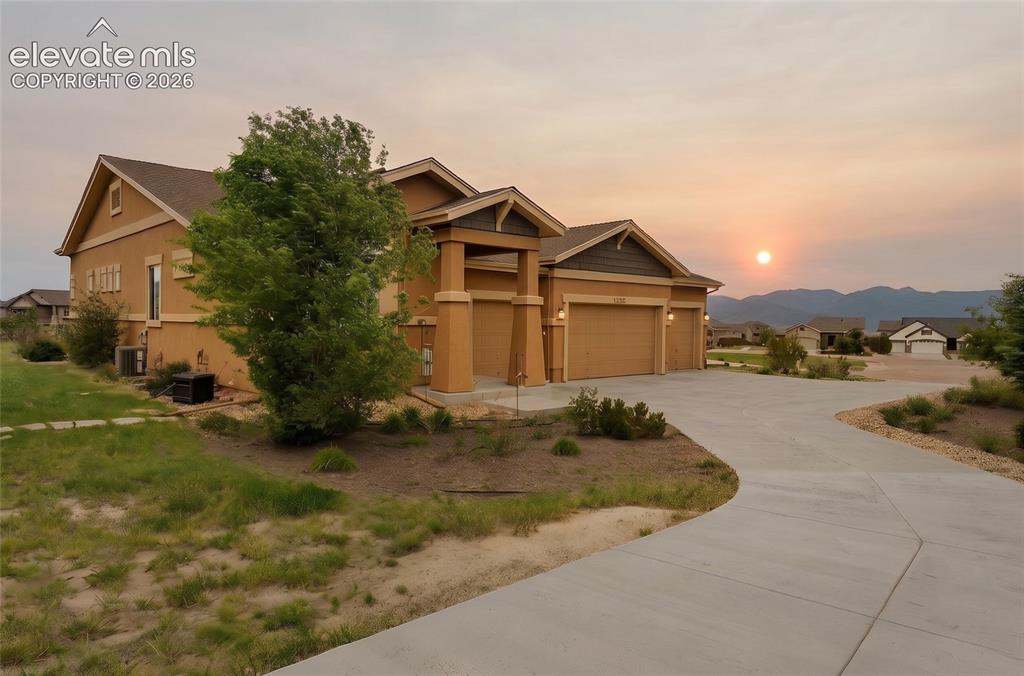 Image 2 of 49: Front of house at sunset