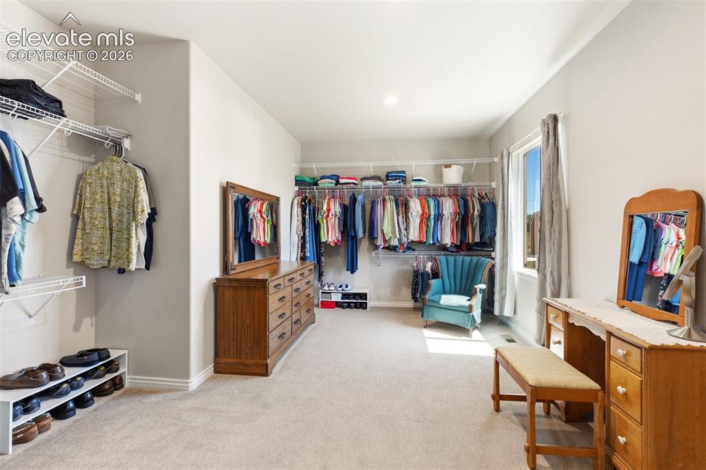 Image 24 of 49: Gigantic primary dressing room/closet