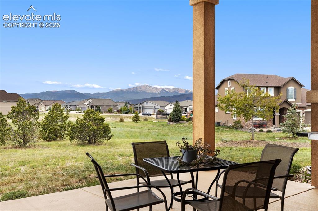 Image 5 of 49: Gorgeous view of Pikes Peak from covered patio