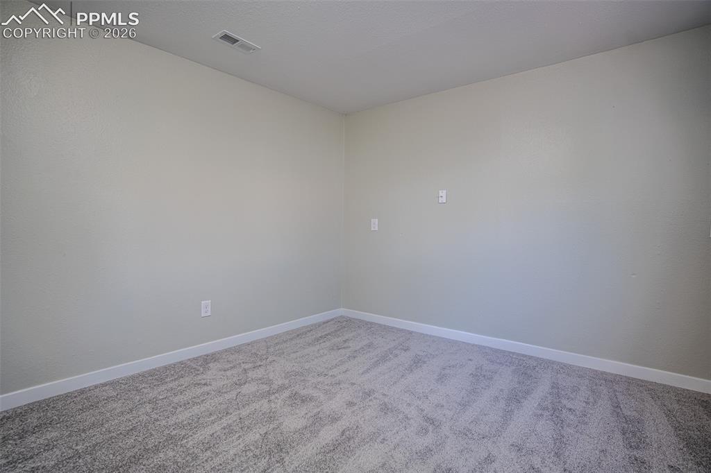 Image 13 of 24: bedroom located in basement perfect for short term guests