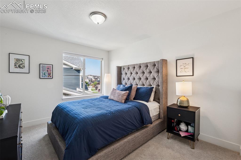 Image 26 of 43: Carpeted bedroom with baseboards
