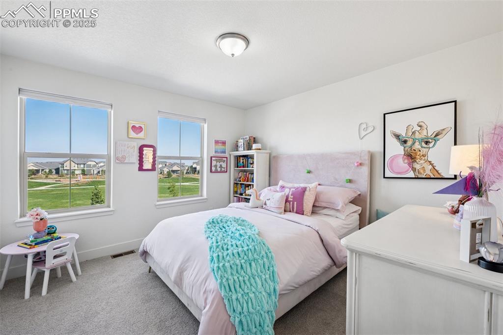 Image 30 of 43: Carpeted bedroom featuring baseboards