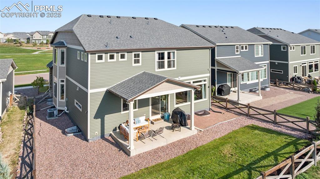 Image 41 of 43: Rear view of property featuring a patio, a residential view, a fenced backy