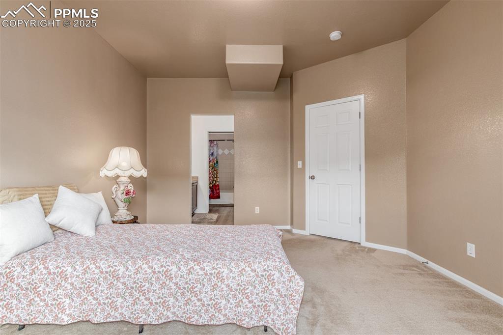 Image 11 of 29: Oversized primary bedroom with en-suite is the perfect escape