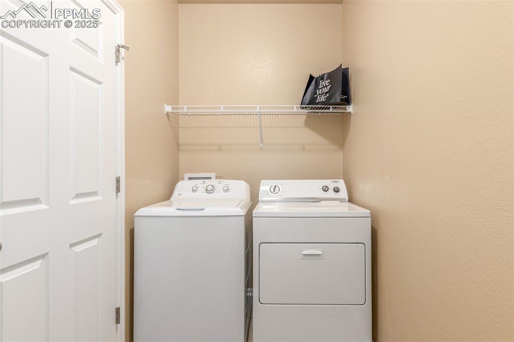 Image 25 of 29: Mudroom/laundry area off the garage 