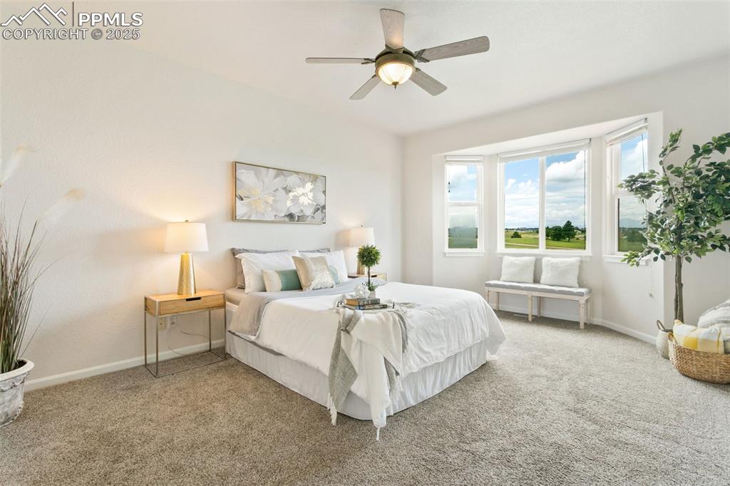 Image 19 of 44: Carpeted bedroom featuring baseboards and ceiling fan