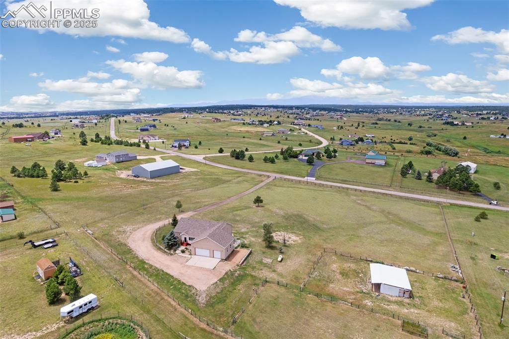 Image 2 of 44: Aerial view of sparsely populated area with a pastoral area