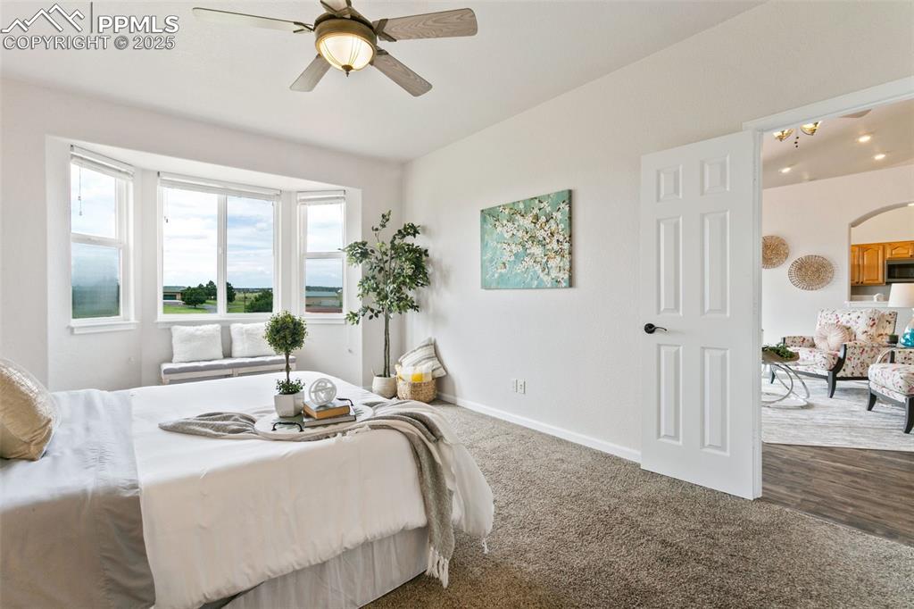 Image 20 of 44: Carpeted bedroom featuring baseboards and a ceiling fan