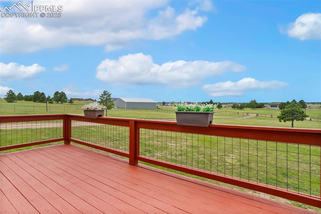 Image 3 of 44: Wooden deck with a view of countryside & mountains!