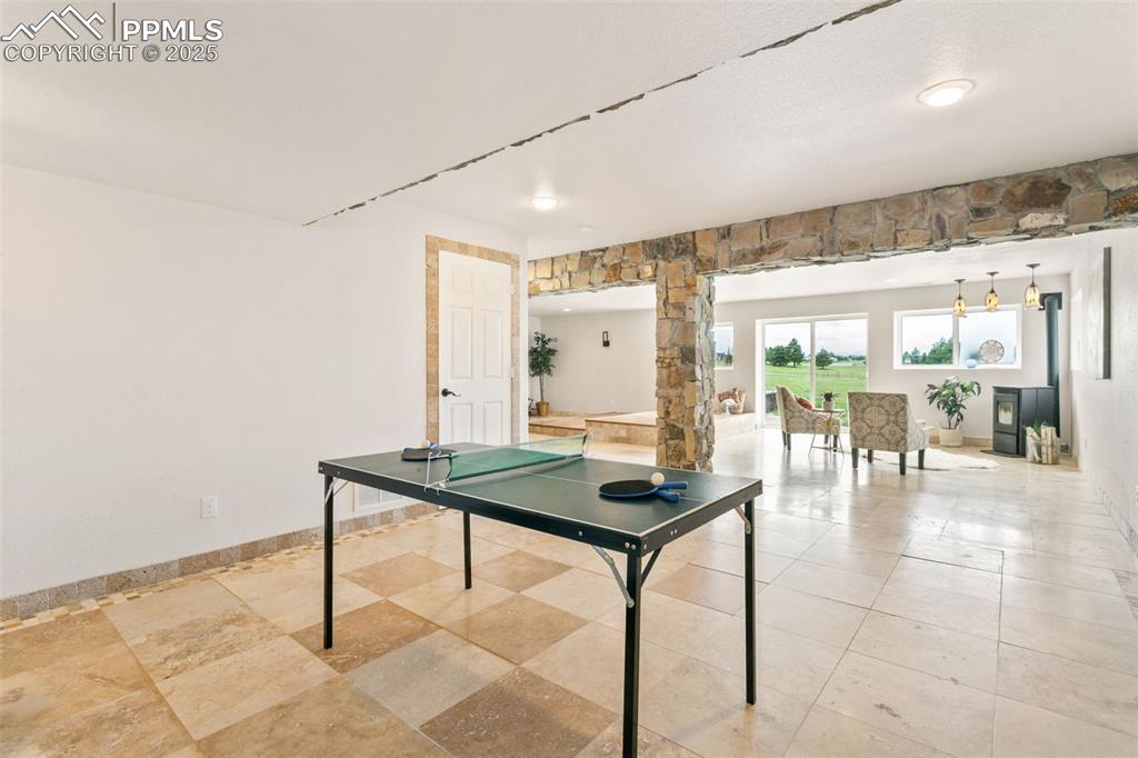 Image 32 of 44: Game room with baseboards