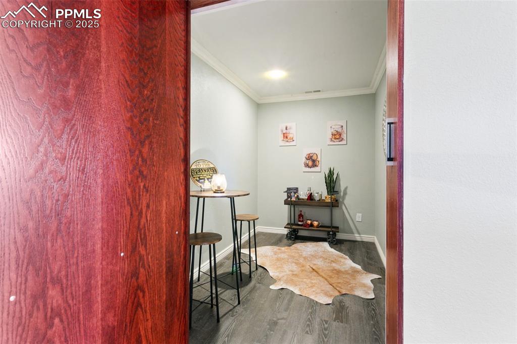 Image 33 of 44: Secret room behind bookcase - make a speakeasy or storage of your pew pew