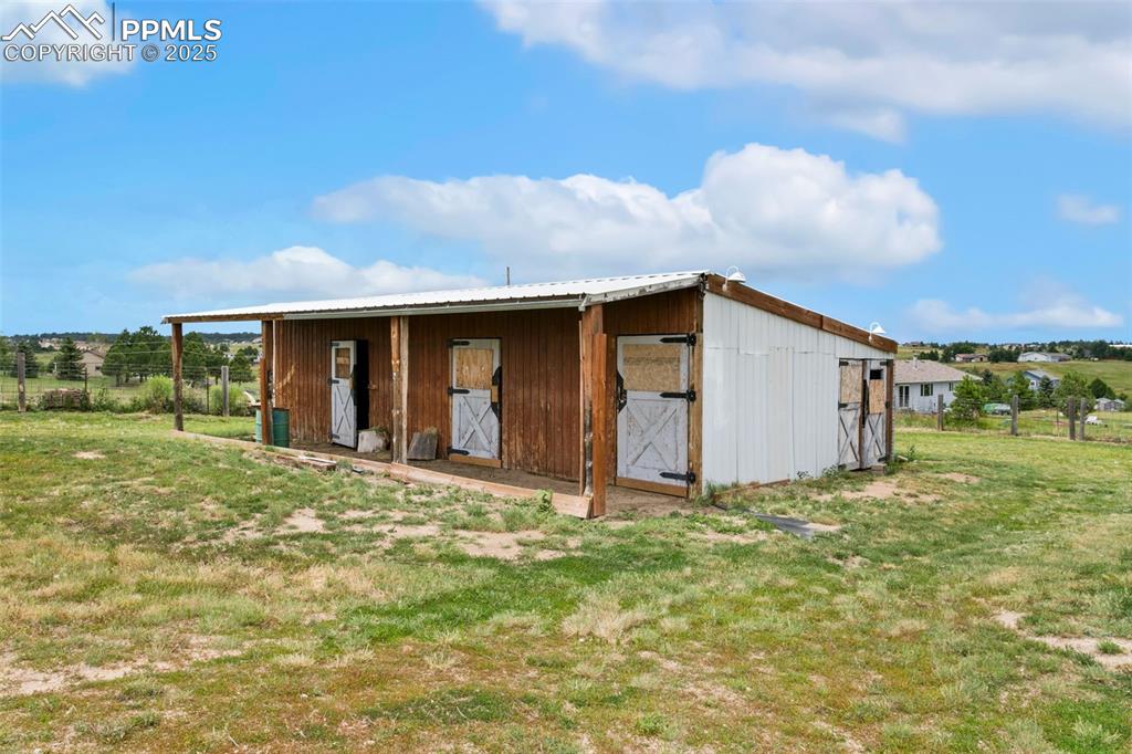 Image 4 of 44: View of outbuilding featuring an exterior structure