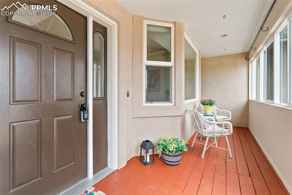 Image 6 of 44: View of exterior entry featuring stucco siding
