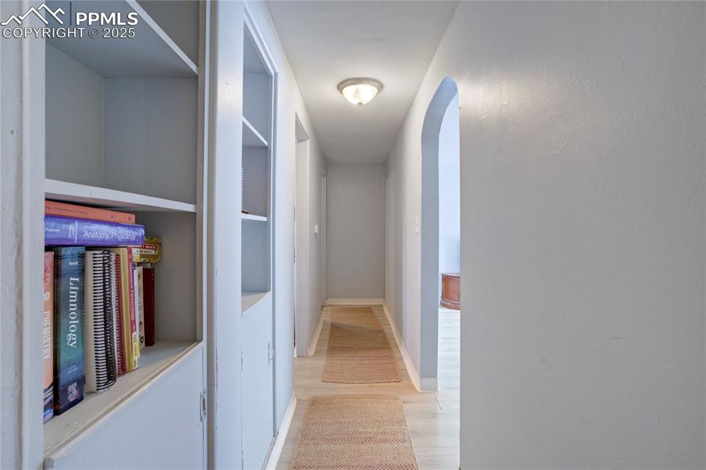 Image 13 of 28: Corridor with light wood finished floors