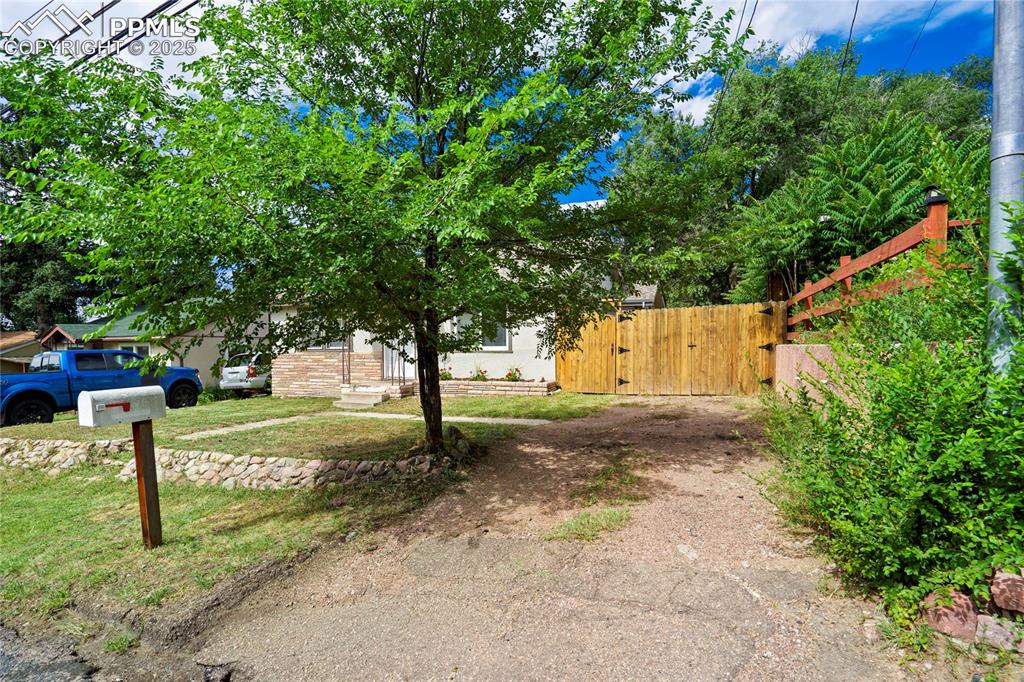 Image 2 of 28: View of yard with a gate