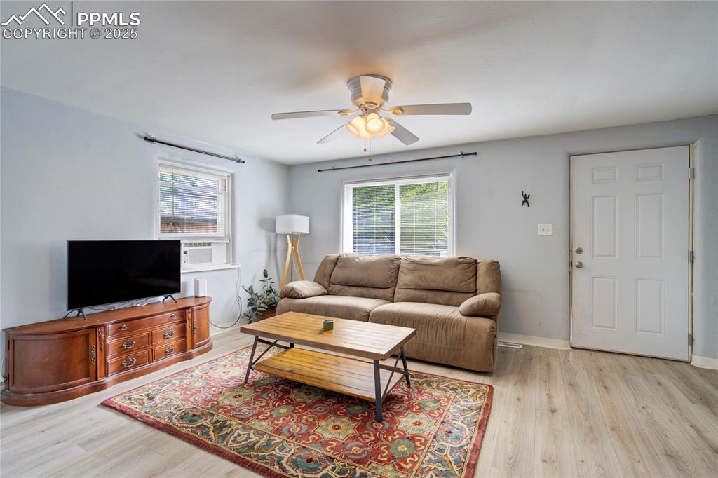 Image 6 of 28: Living area with plenty of natural light, light wood-style floors, and ceil