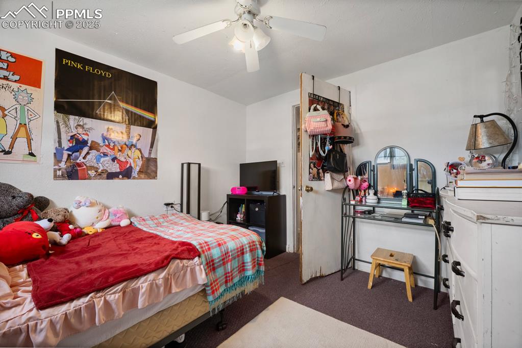 Image 17 of 24: Bedroom featuring carpet flooring and ceiling fan