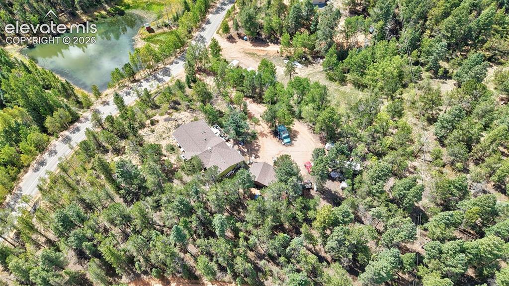 Image 5 of 21: Spacious property featuring a main residence, an auxiliary structure, and e