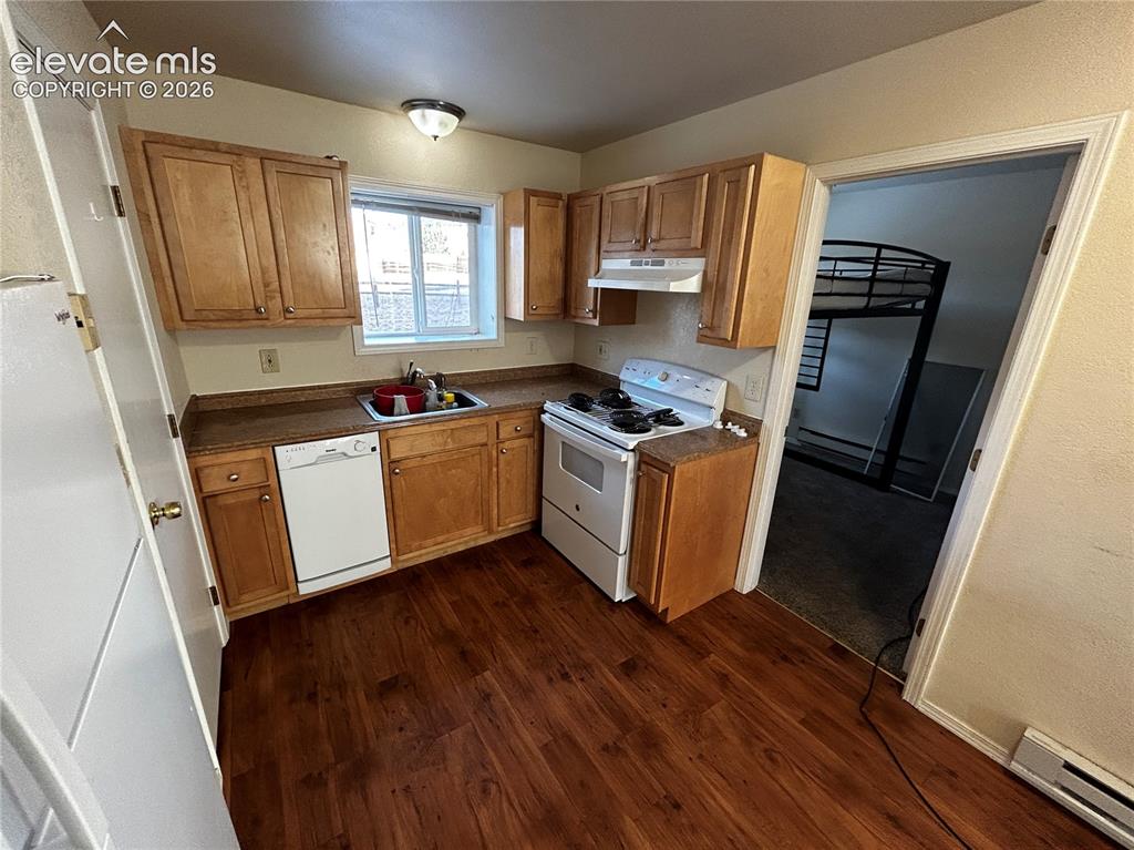 Image 3 of 12: Kitchen featuring wood-finish flooring, light wood cabinetry, laminate coun