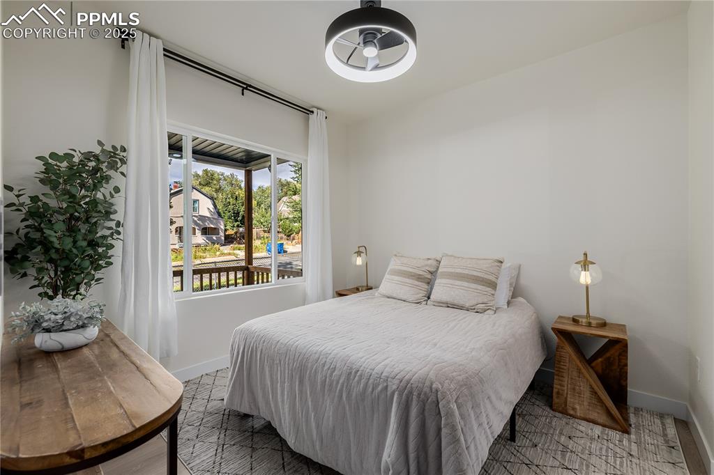 Image 21 of 39: Bedroom featuring baseboards