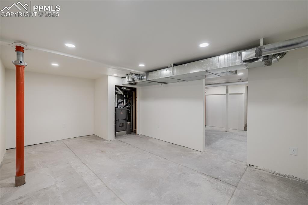 Image 32 of 39: Below grade area with recessed lighting