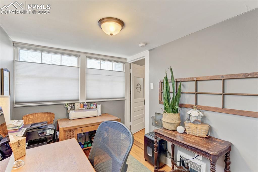 Image 26 of 49: Office area featuring light wood-style flooring