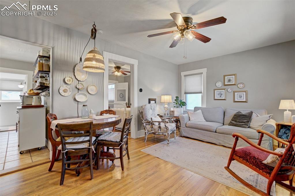 Image 6 of 49: Dining area featuring a ceiling fan, light wood-style flooring, and healthy