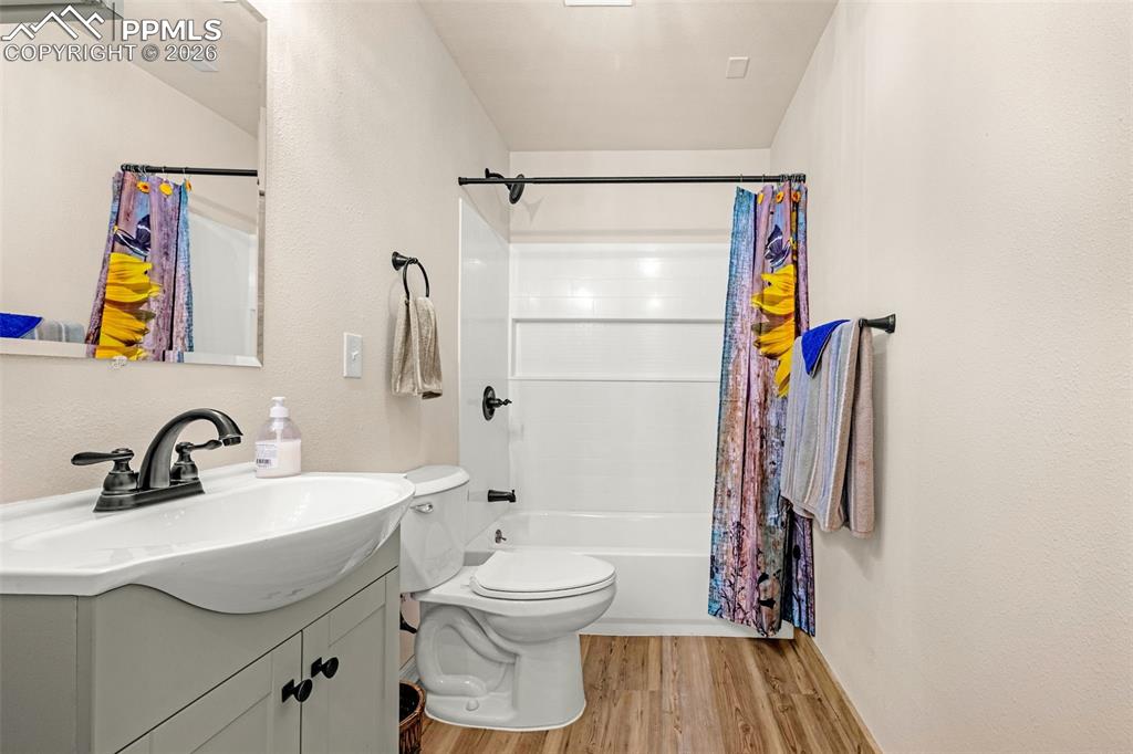 Image 24 of 49: Basement full bath with vanity