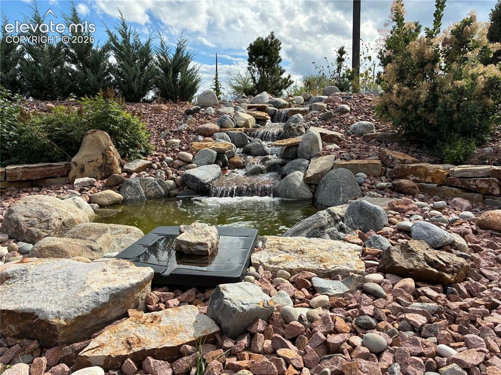 Image 46 of 50: Summer 2025 view of the water feature