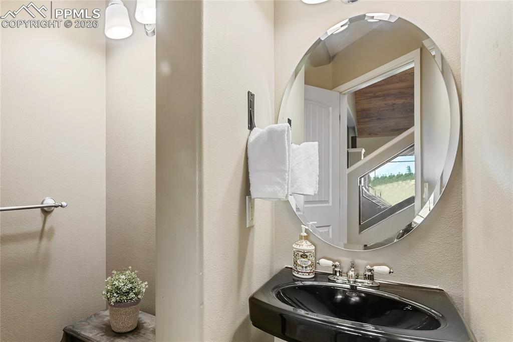 Image 19 of 33: 1/2 bath off the main