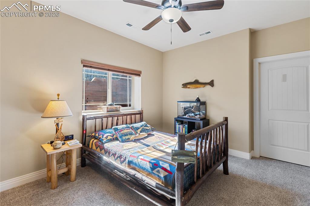 Image 28 of 33: One of two bedrooms on the lower level