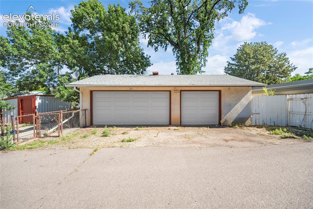 Image 2 of 41: Oversized 3-Car Heated Garage with Alley Access