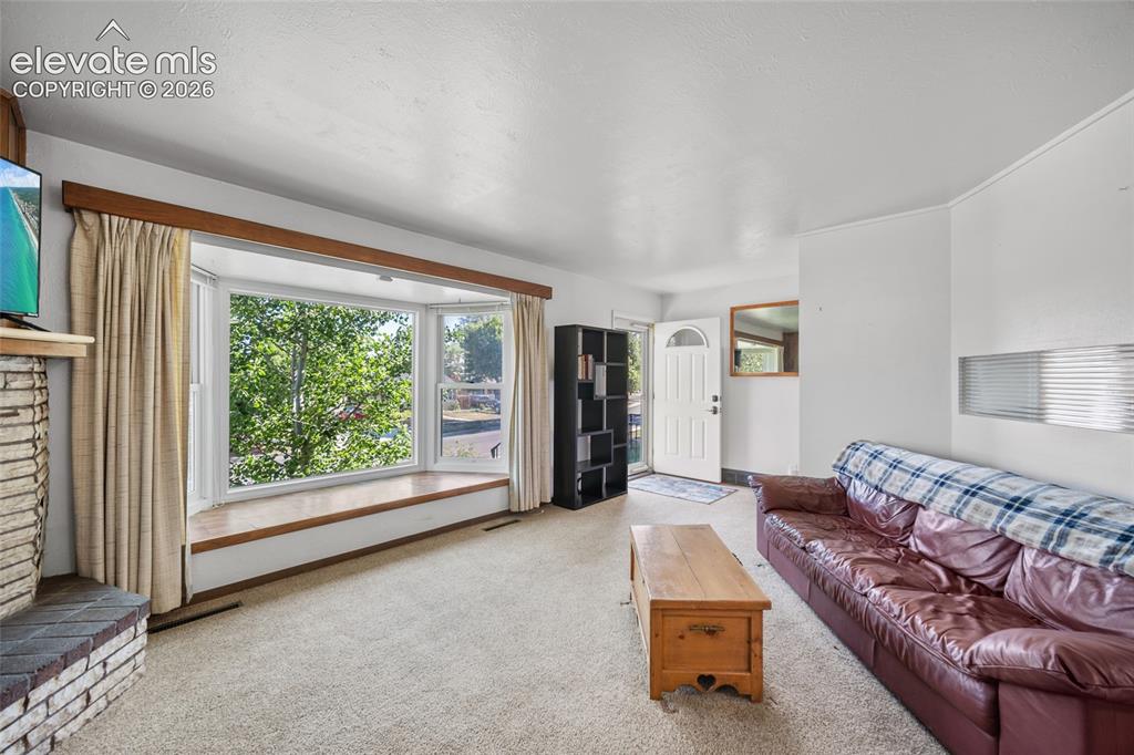 Image 3 of 41: Entry and Living Room with Bay Windows