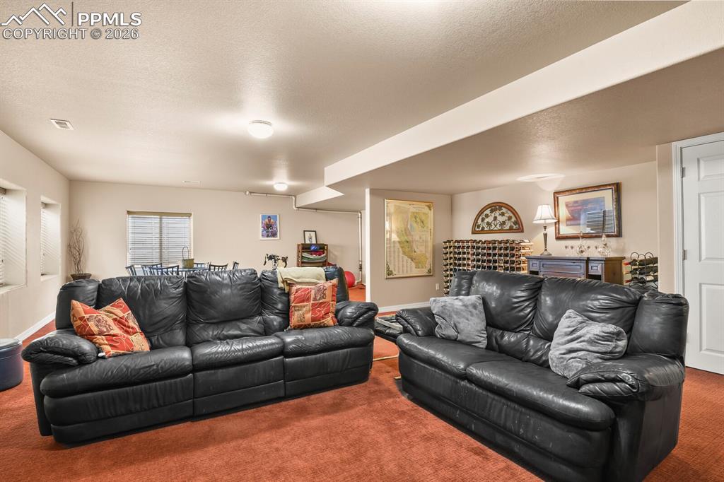 Image 30 of 42: Another view of the Family Room area with carpet flooring.